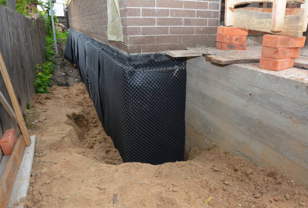 SJ Waterproofing Pros technician performing targeted Waterproofing assessment in Rensselaer, NY